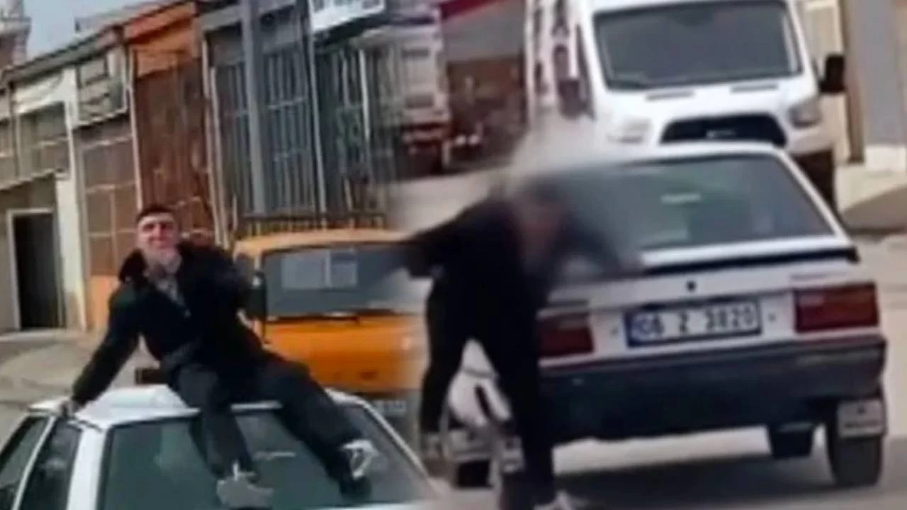 Otomobilin tavan�nda etrafa �p�c�k da��t�rken �l�mden d�nd�