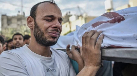İsrail'in hava, kara ve denizden bombaladığı Gazze'de ölü sayısı 7 bin 703'e yükseldi