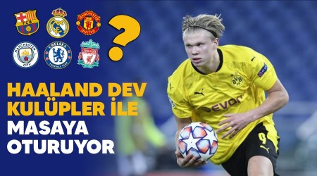 Haaland dev kulpler ile masaya oturuyor 