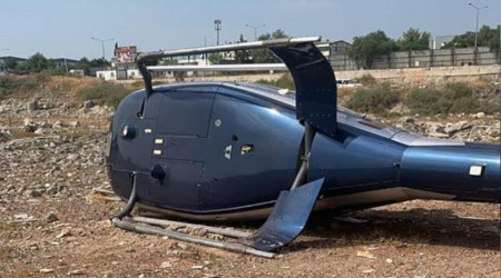İzmir'in Çiğli ilçesinde sivil bir helikopter kalkış esnasında yan yattı. 